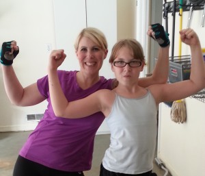 Tabitha and her daughter working out together